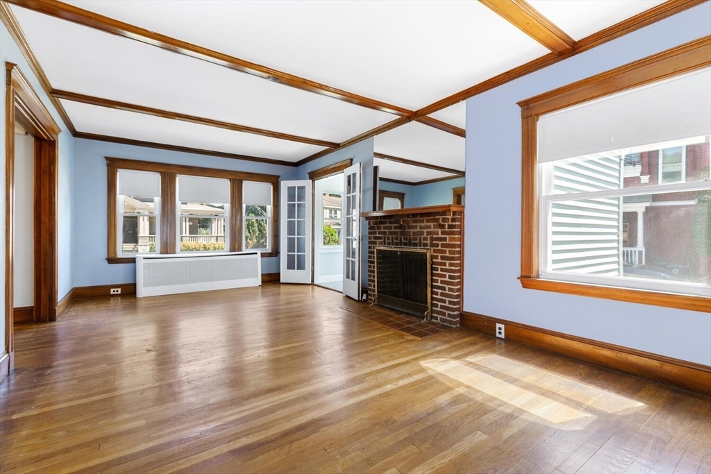 20 Marion Road Watertown, MA 02472 - Photo 8 of 33 a view of an empty room with window and fire place