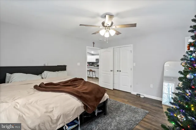 a bedroom with a bed and a potted plant