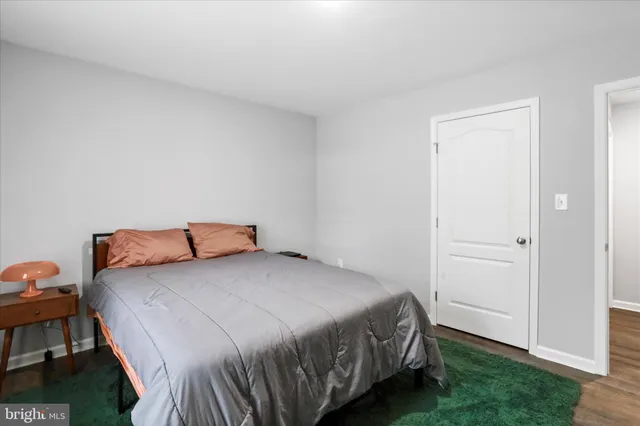 a bedroom with a bed and a closet