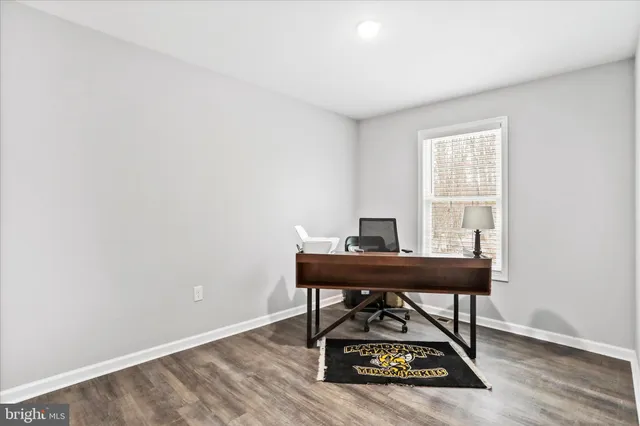 a view of a workspace with furniture