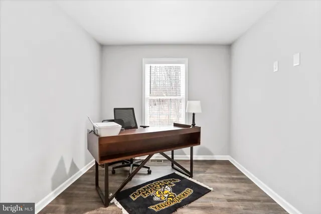 a workspace with furniture and a window