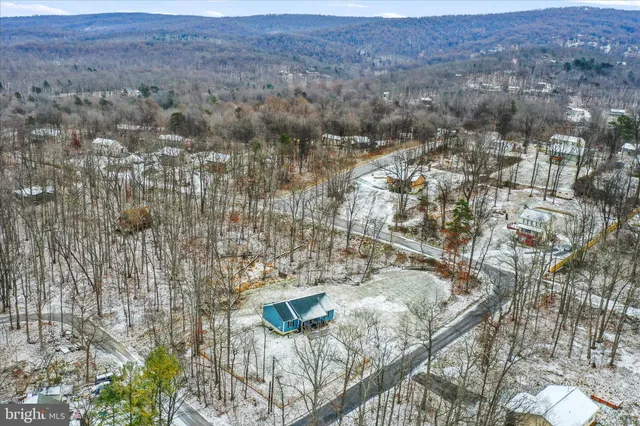 an aerial view of residential house and outdoor space