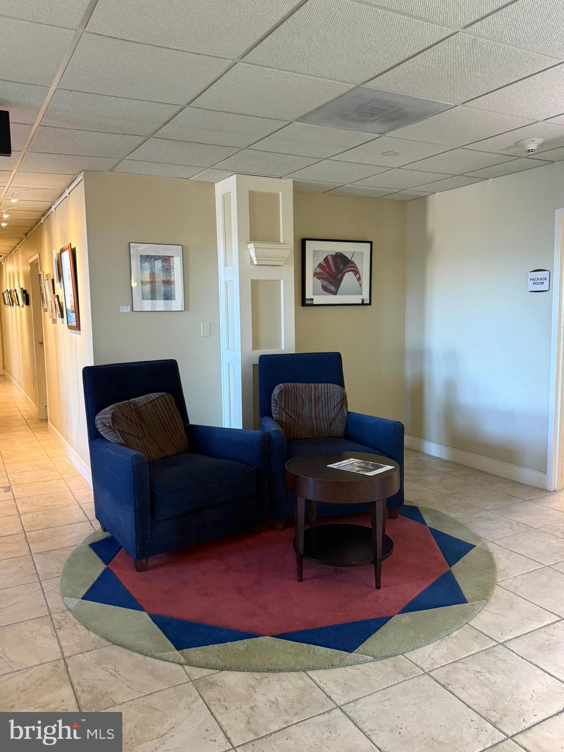 8501 Bayside Road, Unit 702 Chesapeake Beach, MD 20732 - Photo 3 of 11 a living room with furniture and a rug