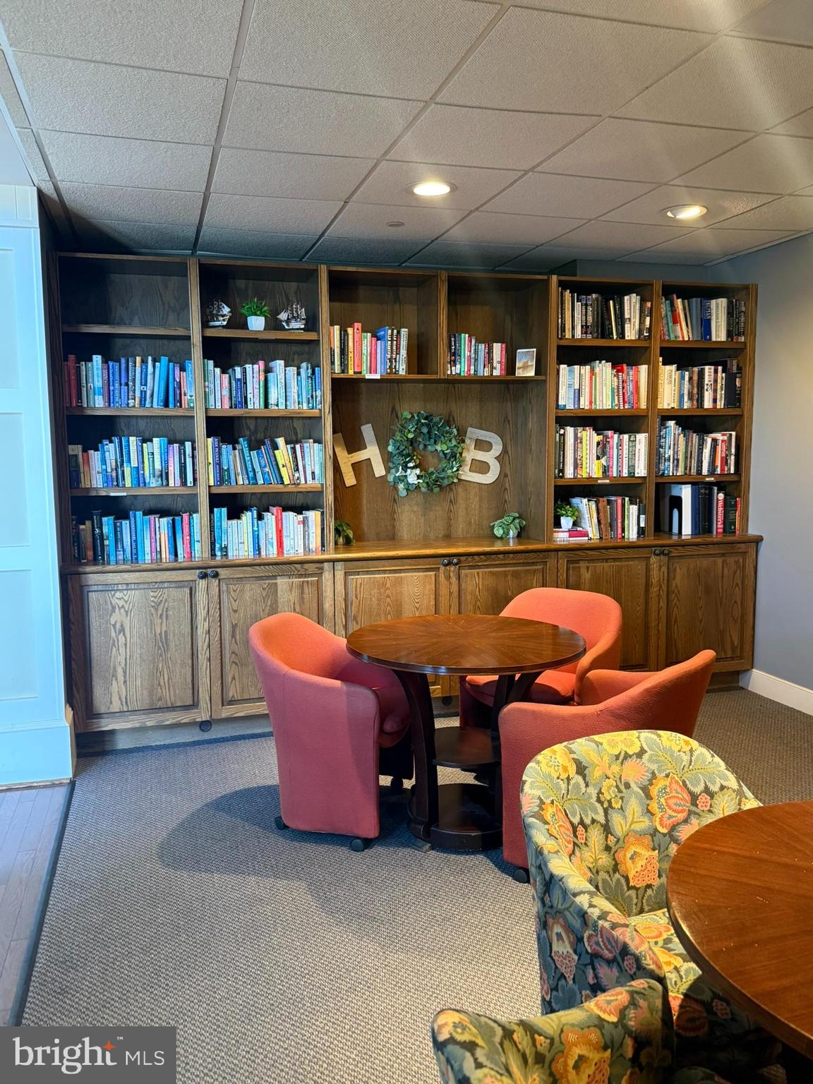 8501 Bayside Road, Unit 702 Chesapeake Beach, MD 20732 - Photo 5 of 11 a room with furniture and a book shelf