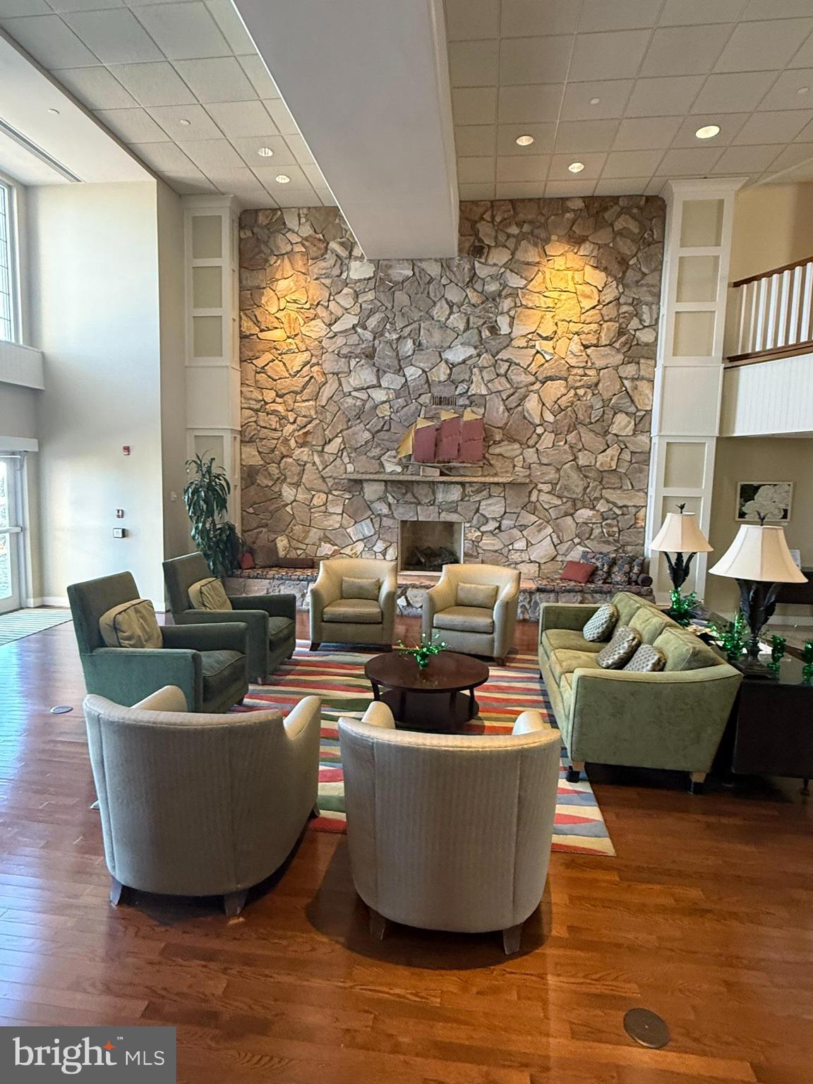 8501 Bayside Road, Unit 702 Chesapeake Beach, MD 20732 - Photo 6 of 11 a living room with furniture and a large window