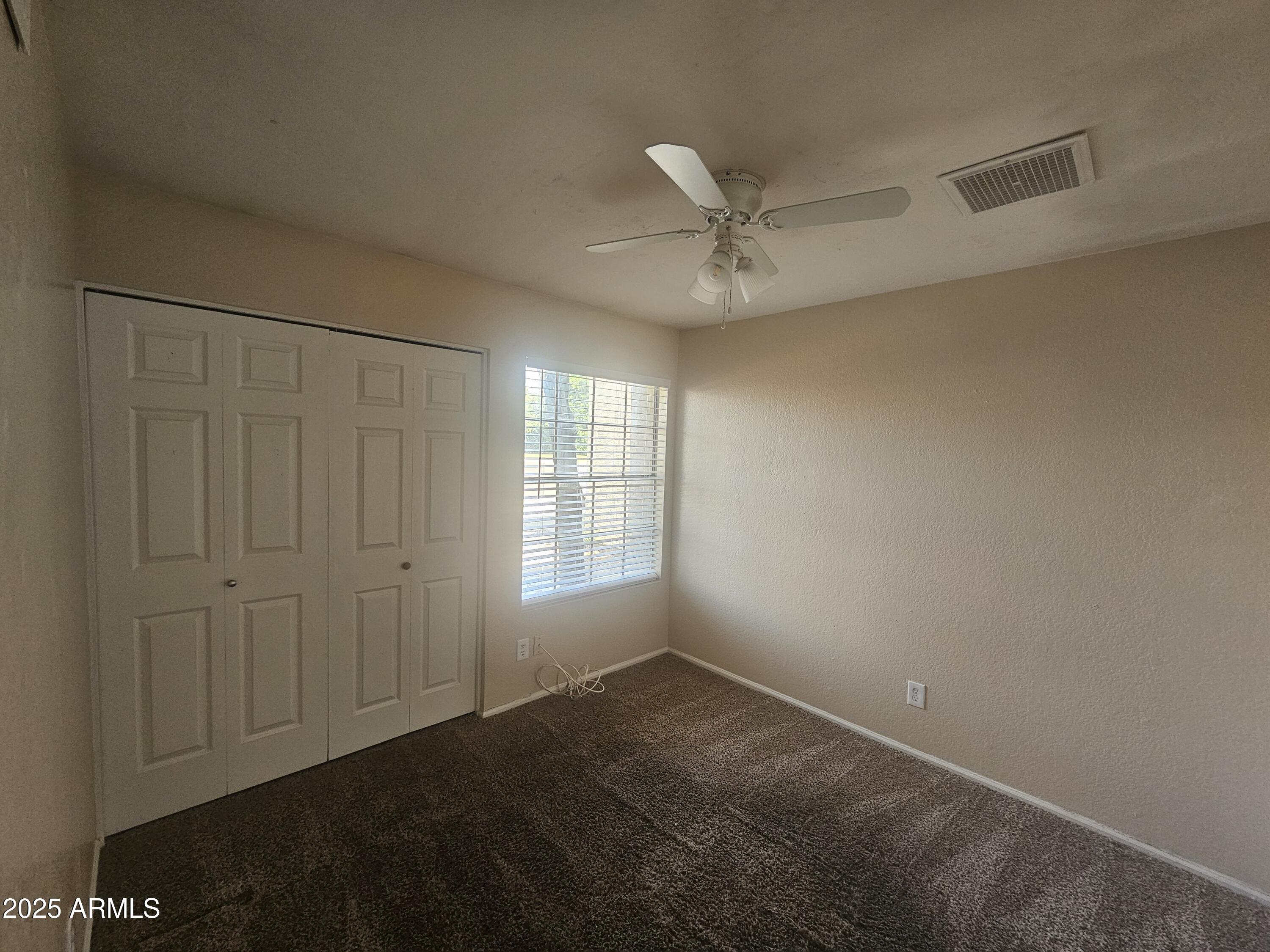 5523 West Yucca Street Glendale, AZ 85304 - Photo 15 of 18 a view of an empty room with a window