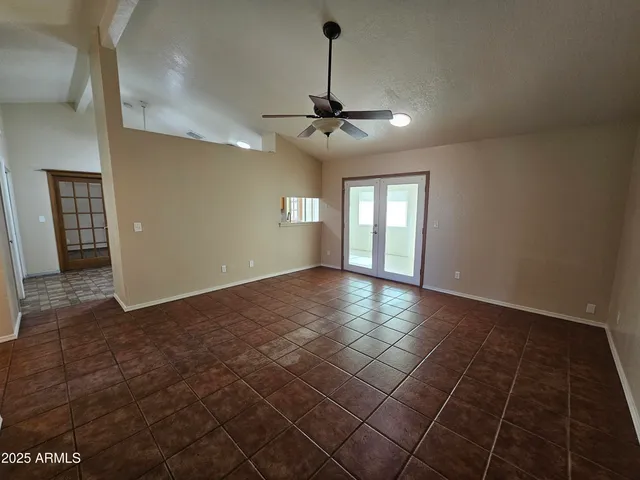 a view of an empty room with glass door