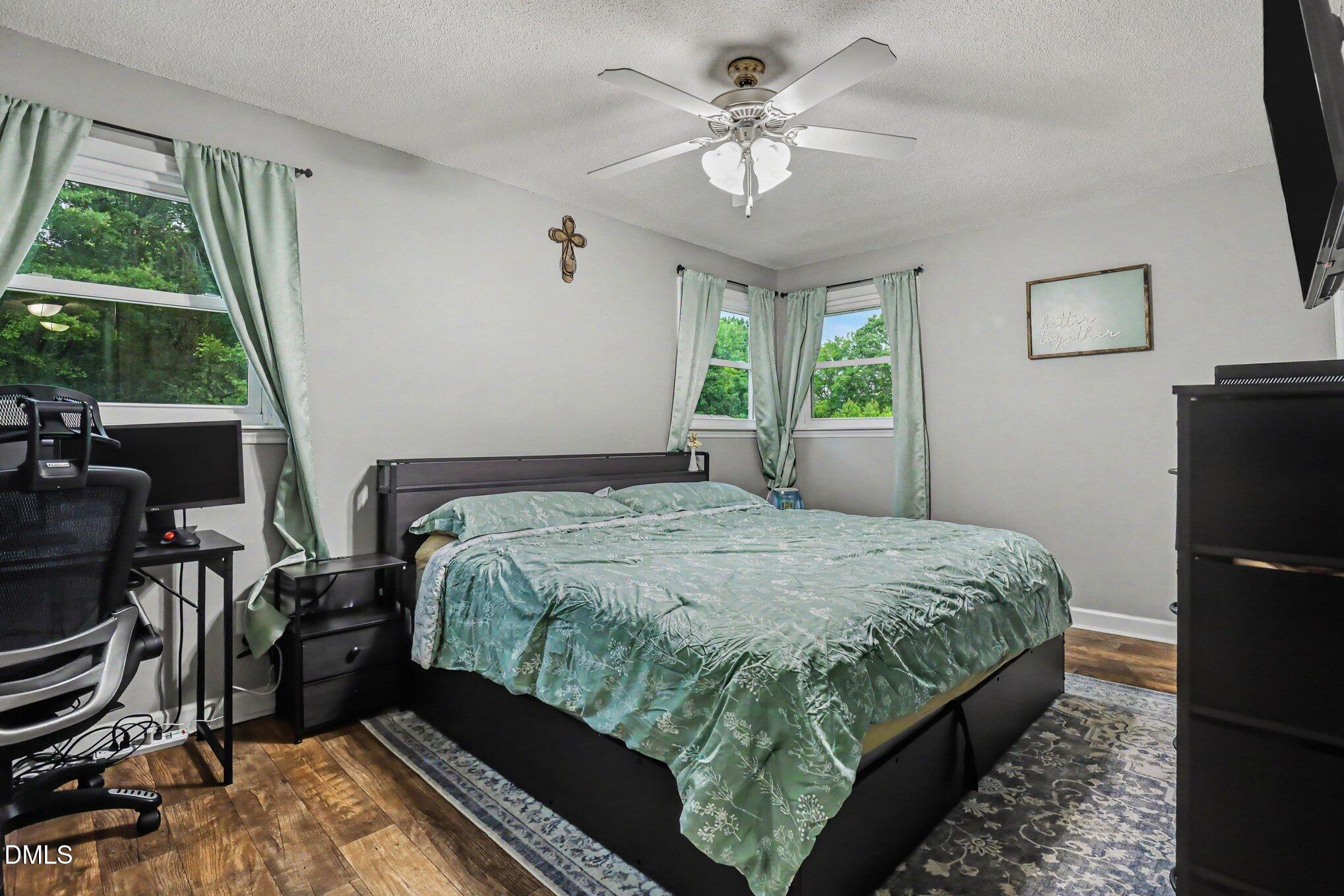 977 Stevens Mill Road Goldsboro, NC 27530 - Photo 20 of 31 a bedroom with a bed dresser and a window