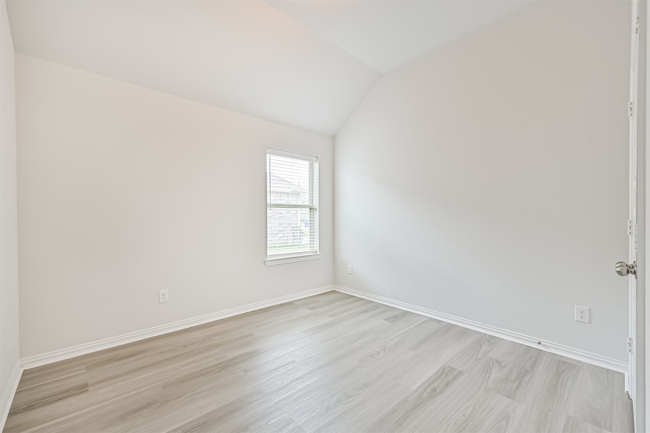 7019 Terra Drive Manvel, TX 77578 - Photo 26 of 41 an empty room with wooden floor and windows