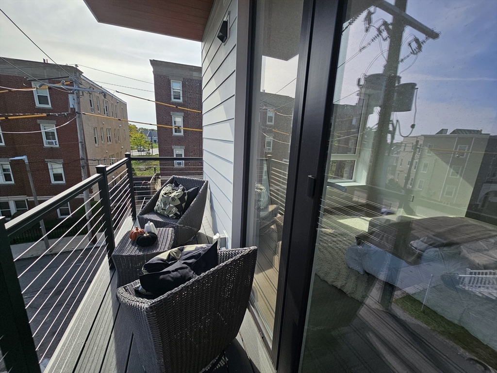 64 Alpine Street, Unit 304 Boston, MA 02119 - Photo 11 of 23 a view of balcony with furniture