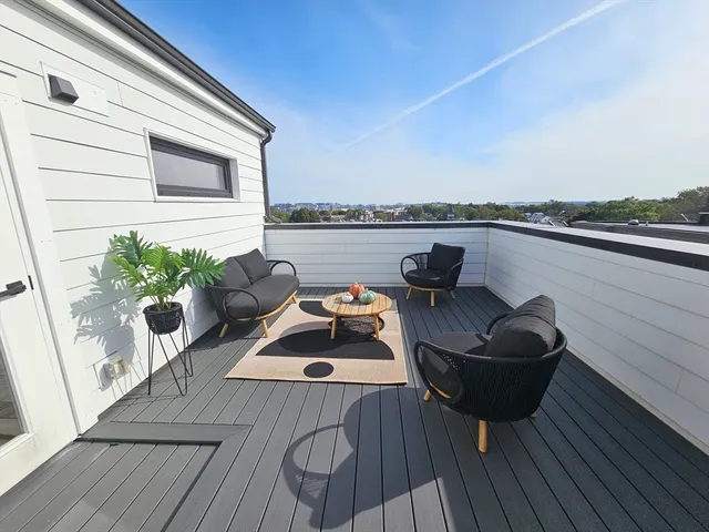 a view of sitting area with furniture and wooden floor