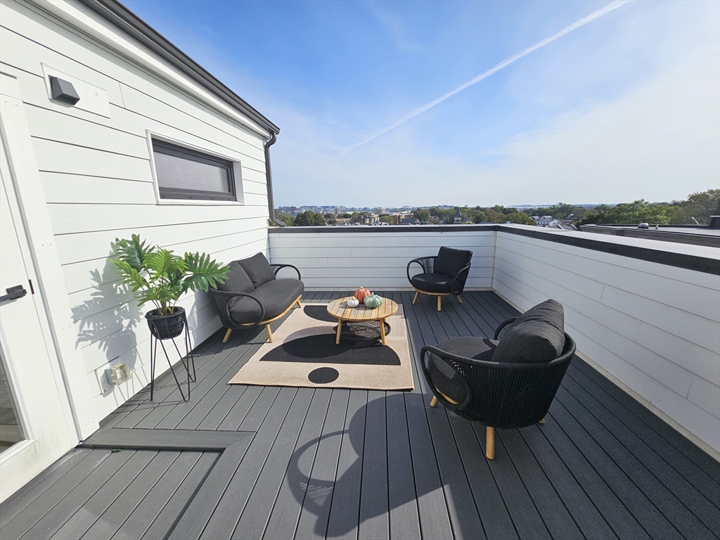 64 Alpine Street, Unit 304 Boston, MA 02119 - Photo 8 of 23 a view of sitting area with furniture and wooden floor