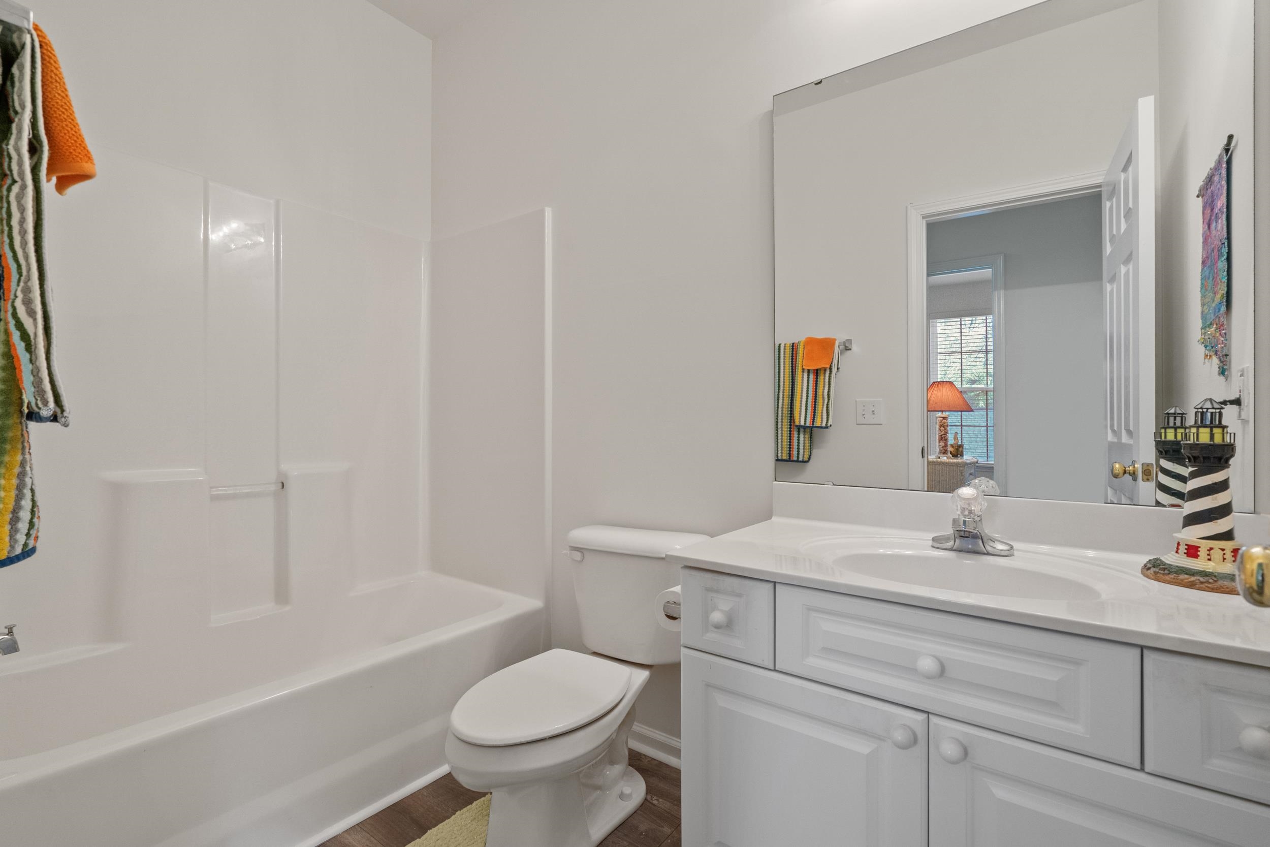 4436 Lady Banks Lane, Unit D2 Murrells Inlet, SC 29576 - Photo 16 of 32 Bathroom featuring vanity, shower / washtub combination, and dark wood-style flooring
