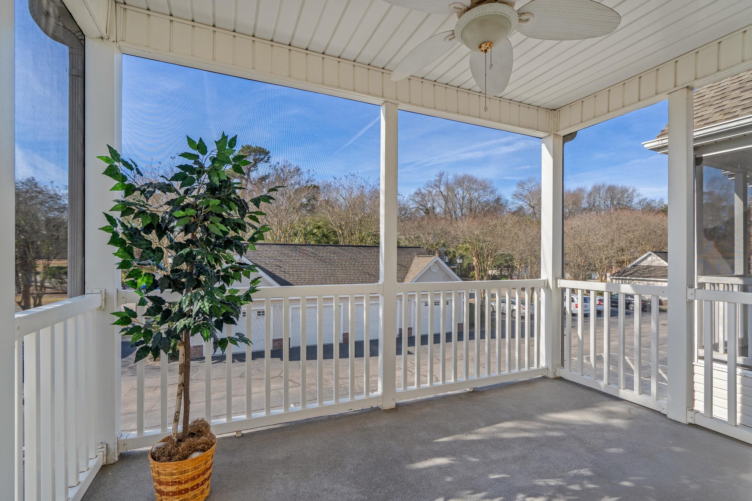 4436 Lady Banks Lane, Unit D2 Murrells Inlet, SC 29576 - Photo 21 of 32 Unfurnished sunroom with healthy amount of natural light and carpet flooring