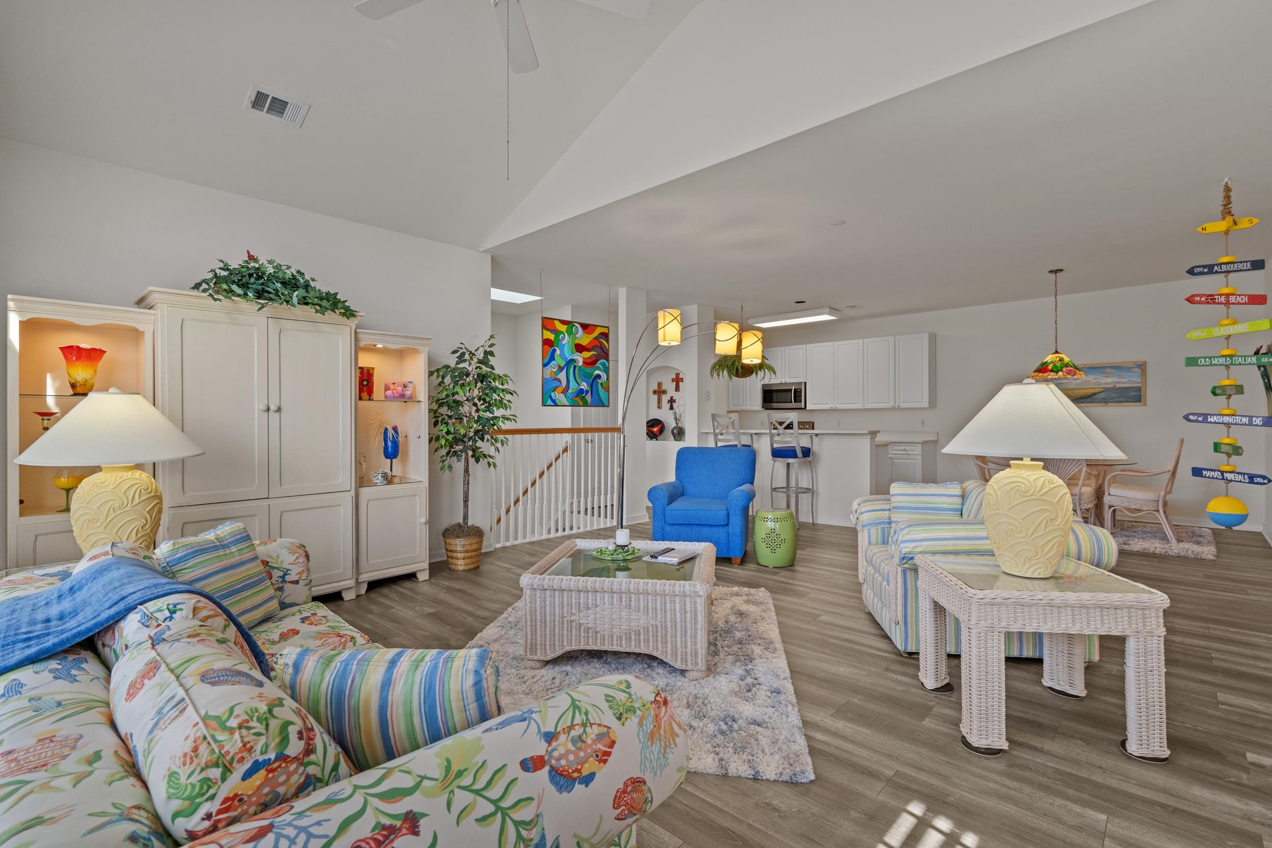 4436 Lady Banks Lane, Unit D2 Murrells Inlet, SC 29576 - Photo 5 of 32 Living area featuring wood finished floors, high vaulted ceiling, and ceiling fan