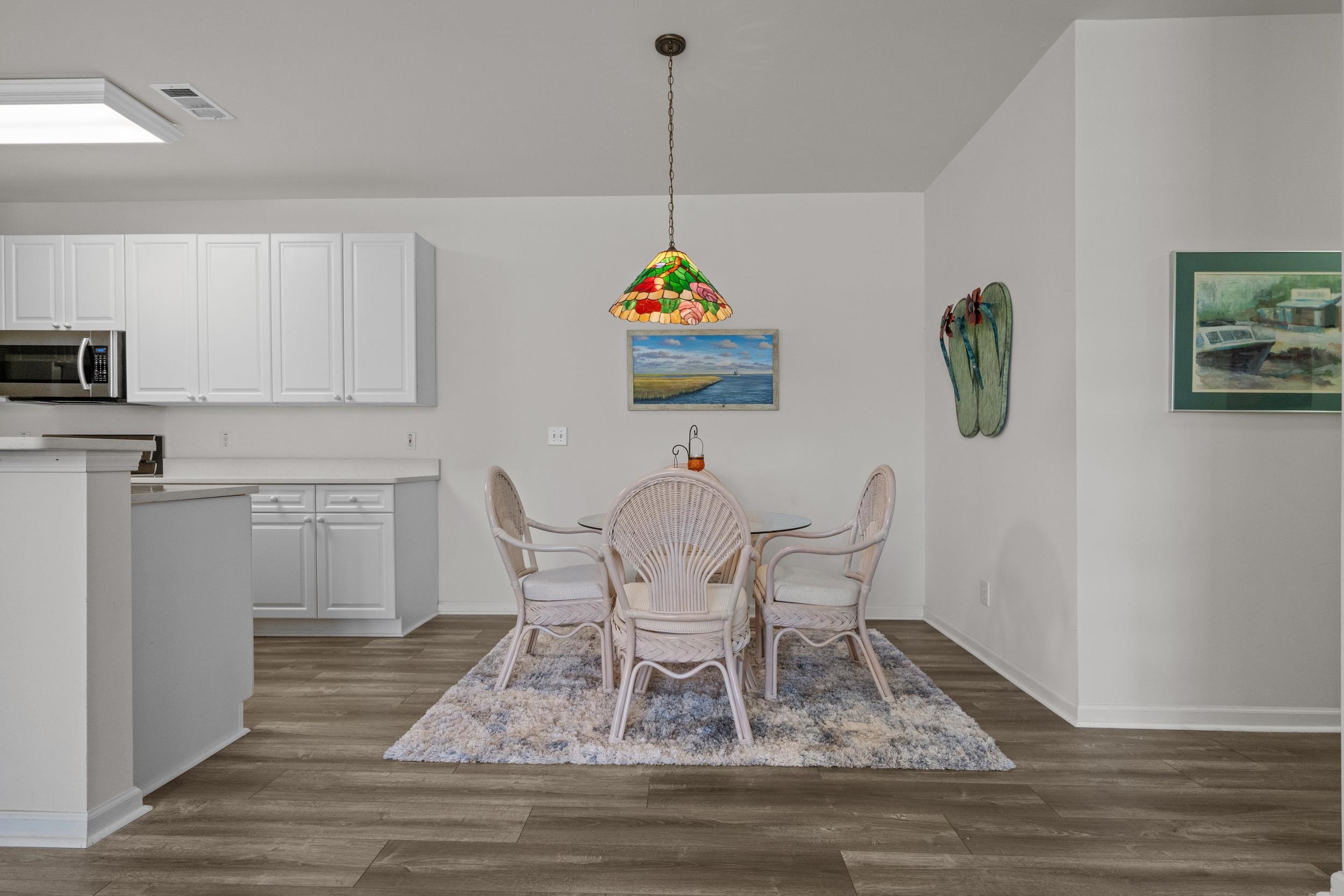 4436 Lady Banks Lane, Unit D2 Murrells Inlet, SC 29576 - Photo 6 of 32 Dining room with dark wood-style flooring