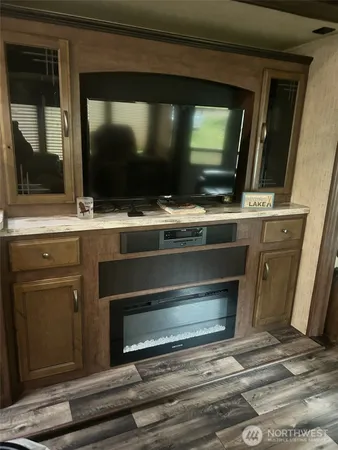 a room with furniture and flat screen tv