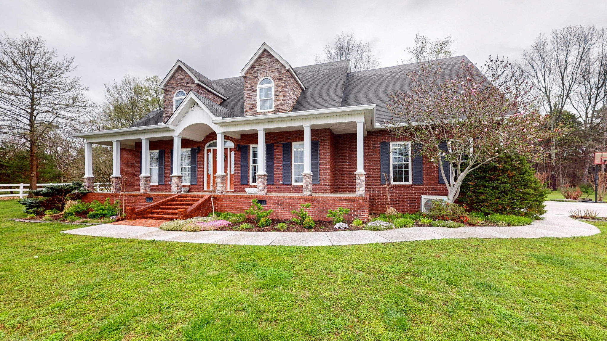3664 Whippoorwill Road Lebanon, TN 37090 - Photo 12 of 69 a front view of a house with a yard table and chairs