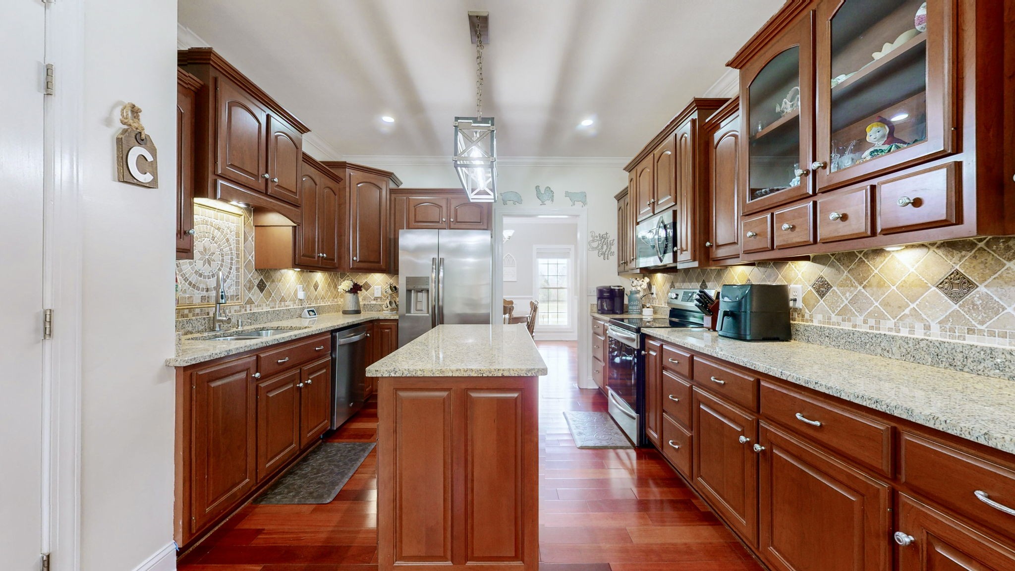 3664 Whippoorwill Road Lebanon, TN 37090 - Photo 34 of 69 a kitchen with stainless steel appliances granite countertop a stove and a sink
