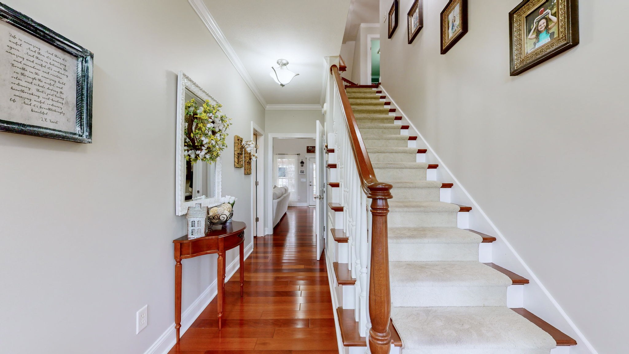 3664 Whippoorwill Road Lebanon, TN 37090 - Photo 35 of 69 a view of staircase with lots of frames on wall and wooden floor
