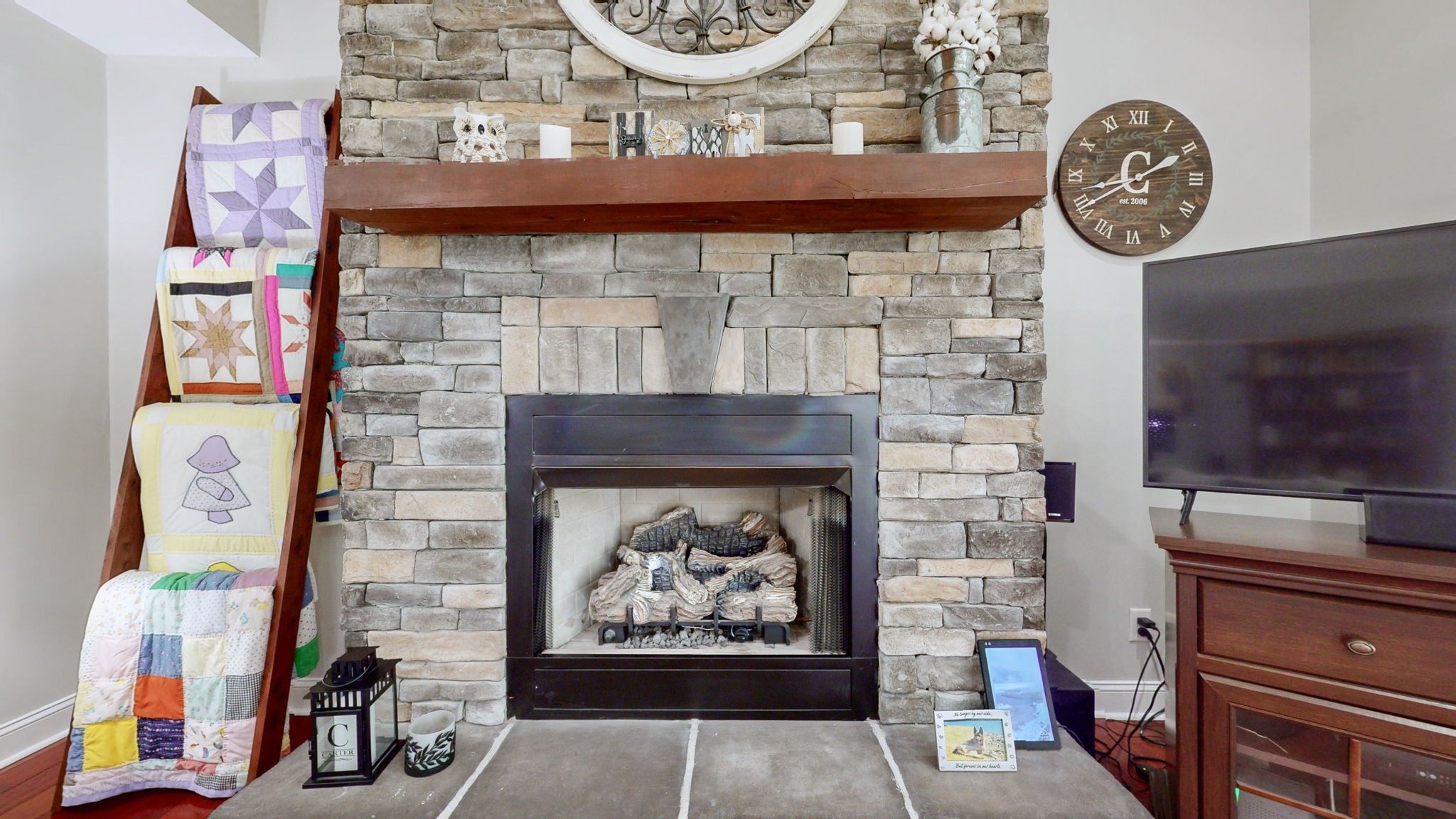 3664 Whippoorwill Road Lebanon, TN 37090 - Photo 41 of 69 a stone fireplace with a clock on it