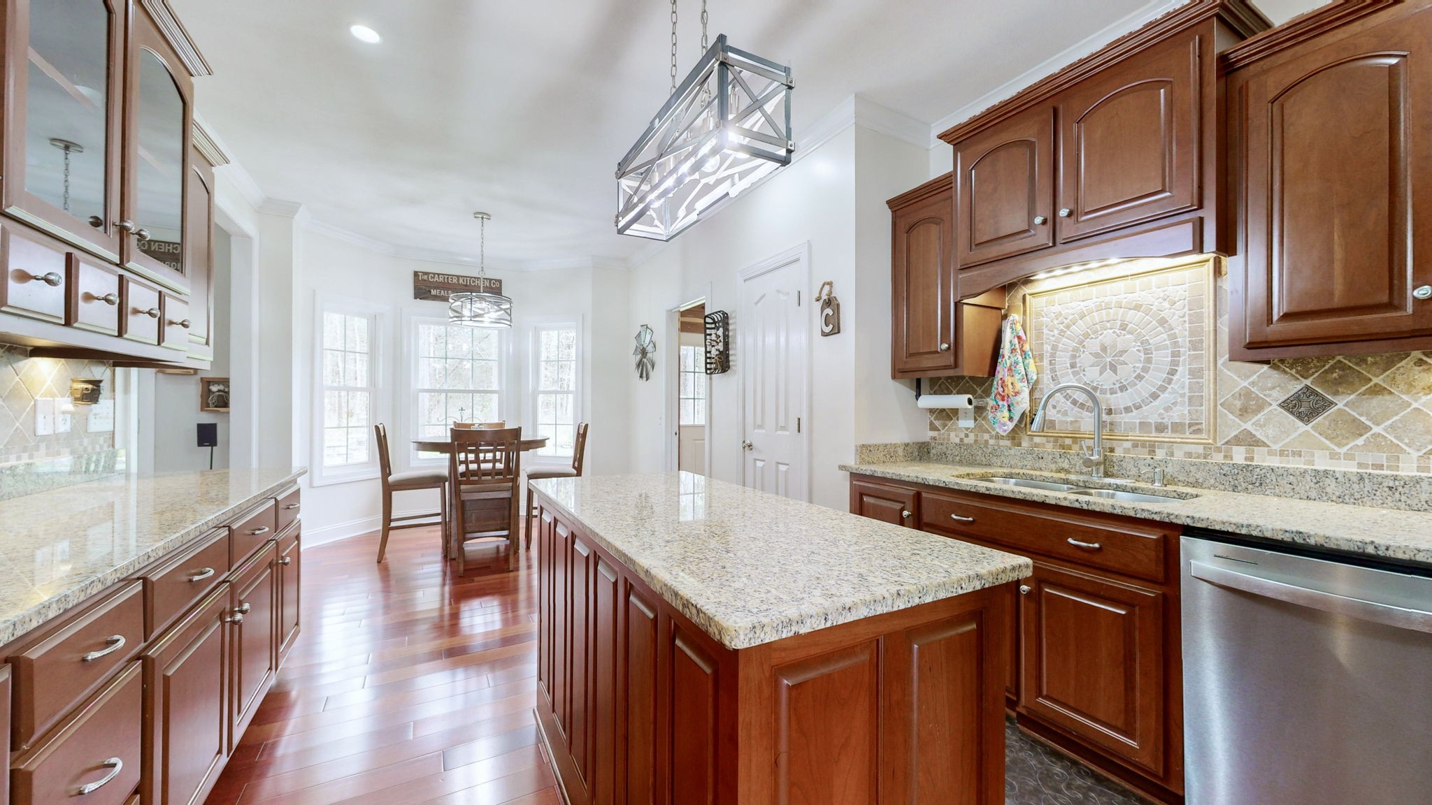 3664 Whippoorwill Road Lebanon, TN 37090 - Photo 47 of 69 a kitchen with granite countertop kitchen island stainless steel appliances a sink and cabinets