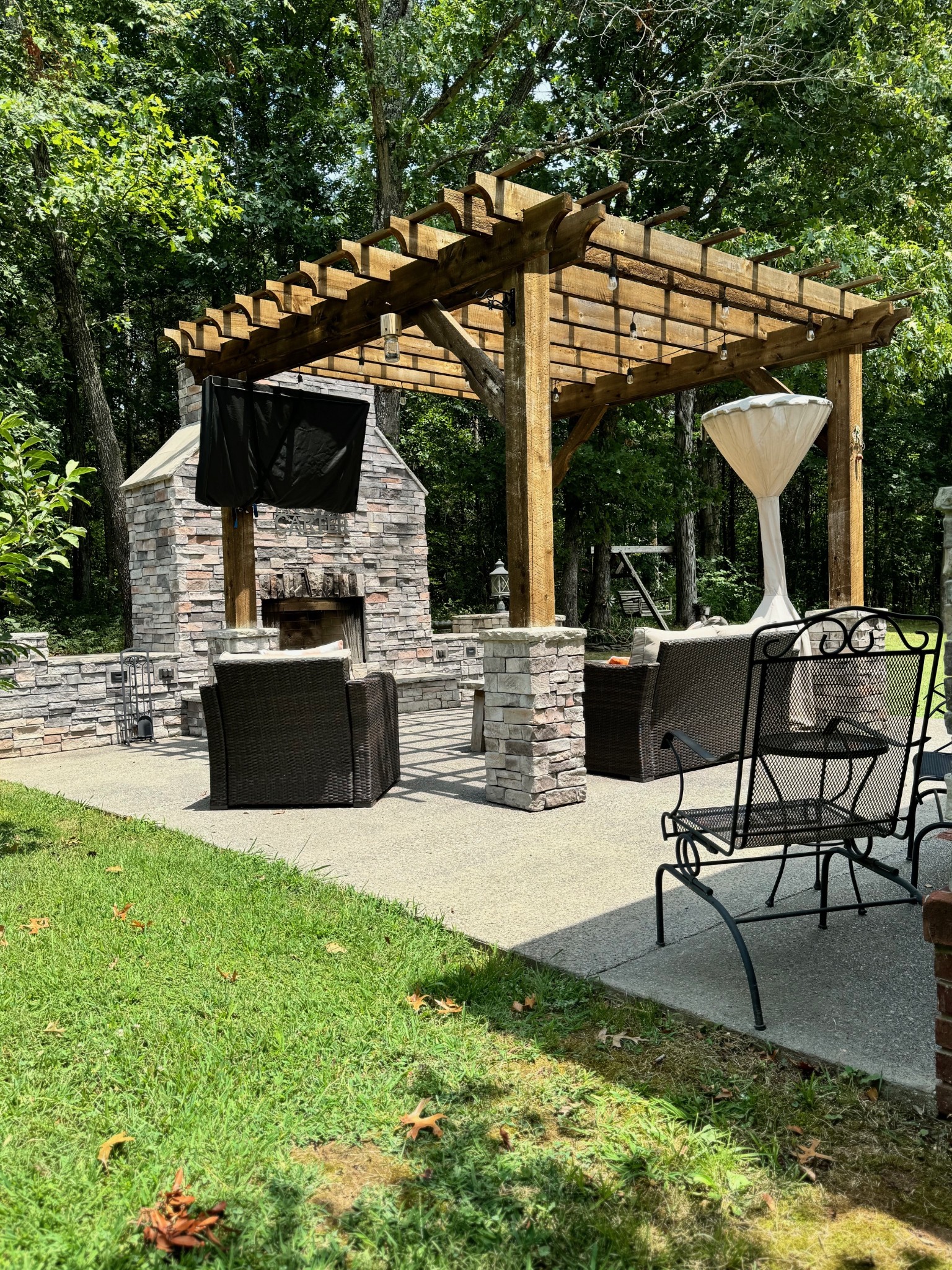 3664 Whippoorwill Road Lebanon, TN 37090 - Photo 5 of 69 a view of a patio with table and chairs potted plants with large tree