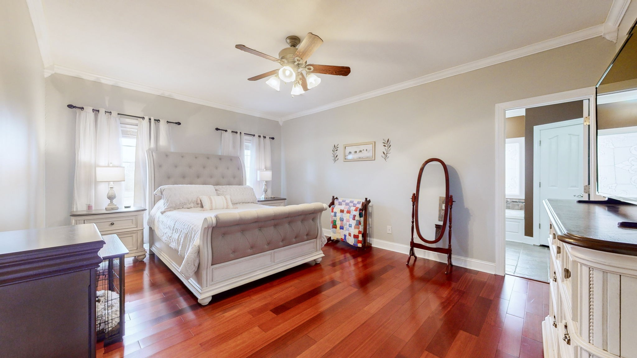 3664 Whippoorwill Road Lebanon, TN 37090 - Photo 51 of 69 a bedroom with a bed a chandelier and dresser