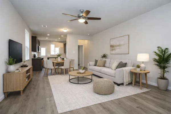 a living room with furniture and a flat screen tv
