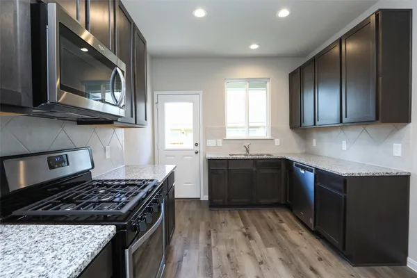 a kitchen with a sink and cabinets