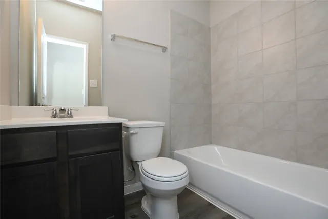 a bathroom with a sink a toilet and a bathtub