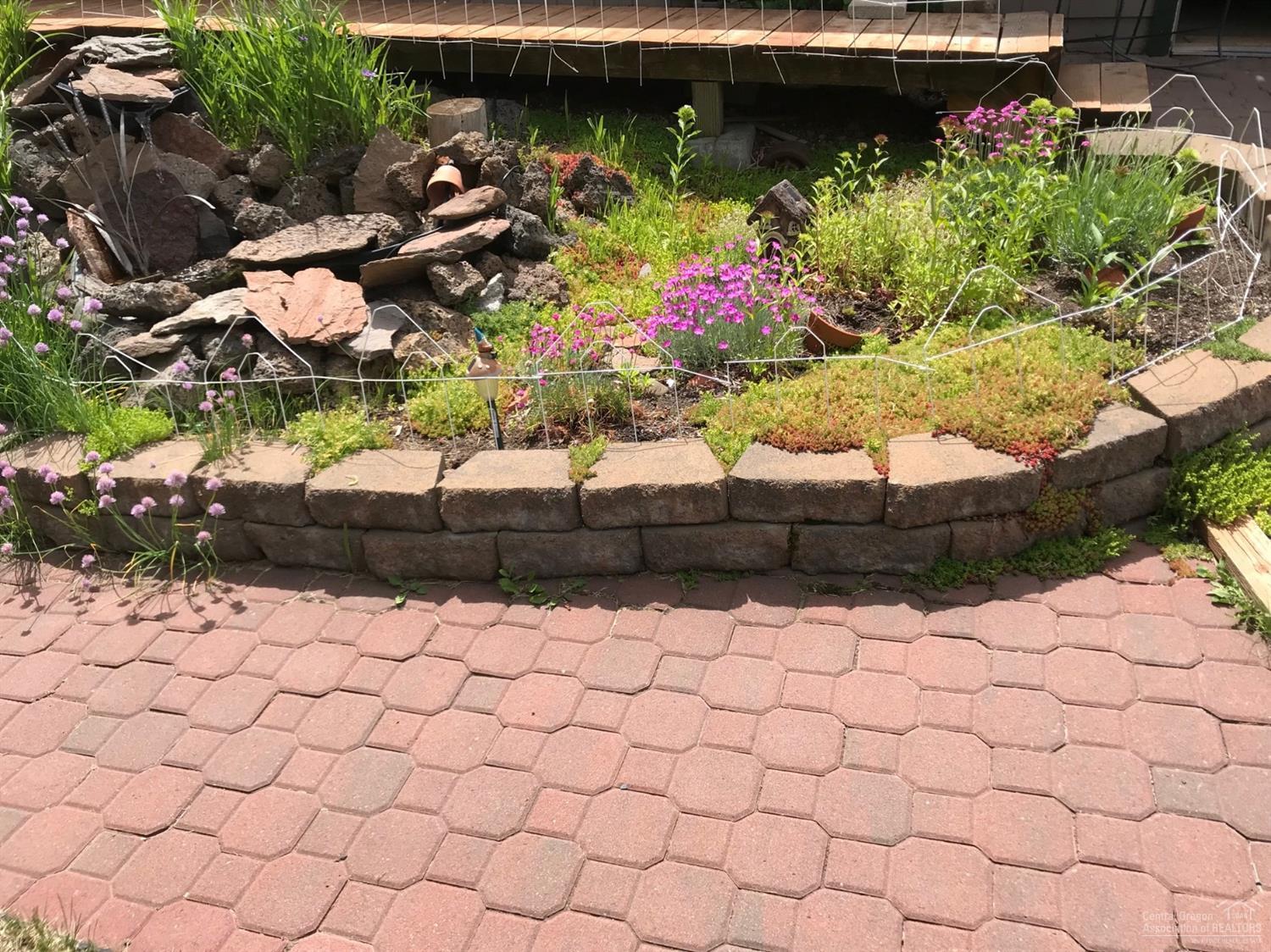 21452 Keyte Lane Bend, OR 97701 - Photo 9 of 25 Paver-stone patio in back with water fea