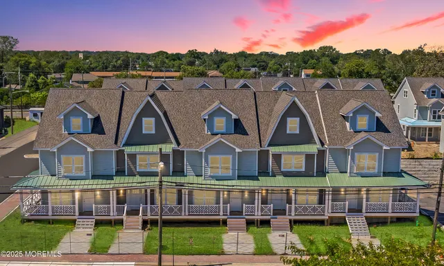 a view of multiple houses with a yard