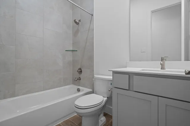 a bathroom with a sink toilet and bathtub
