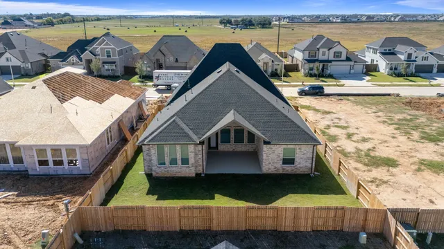 a aerial view of house with yard