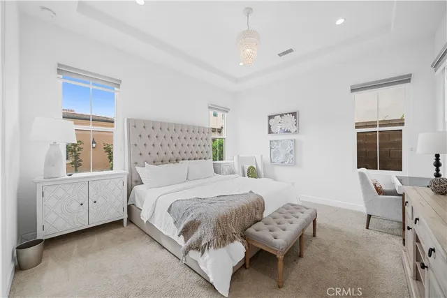 a bedroom with a bed and a couch