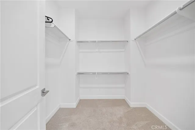 a view of an empty walk in closet