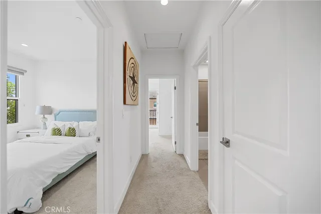 a en suite bathroom with a granite countertop sink and a mirror