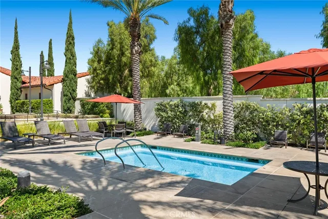 a view of a backyard with sitting area