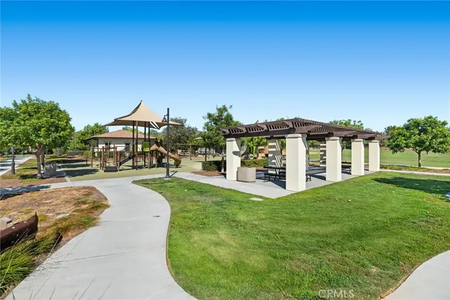a view of a house with a yard porch and sitting area
