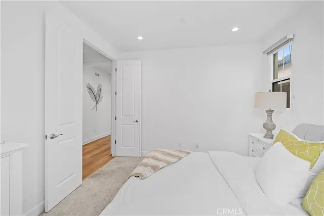 a bedroom with a bed and a sink