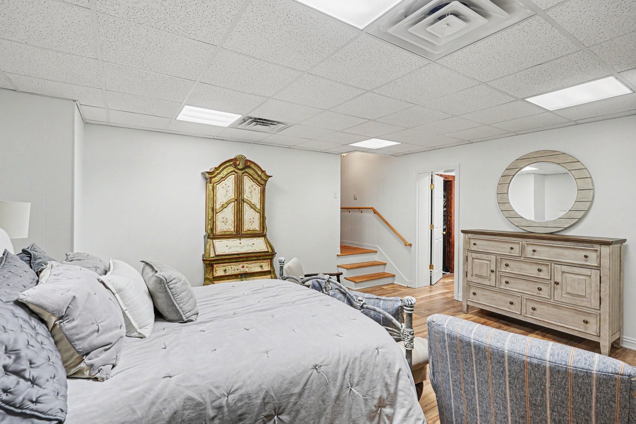 5833 Highway 76 East Springfield, TN 37172 - Photo 23 of 66 a bedroom with a bed a mirror and a dresser with the floor