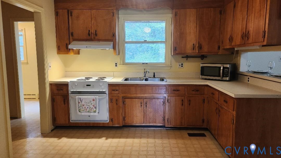 1400 Covington Road Colonial Heights, VA 23834 - Photo 5 of 21 a kitchen with stainless steel appliances granite countertop a sink stove and cabinets