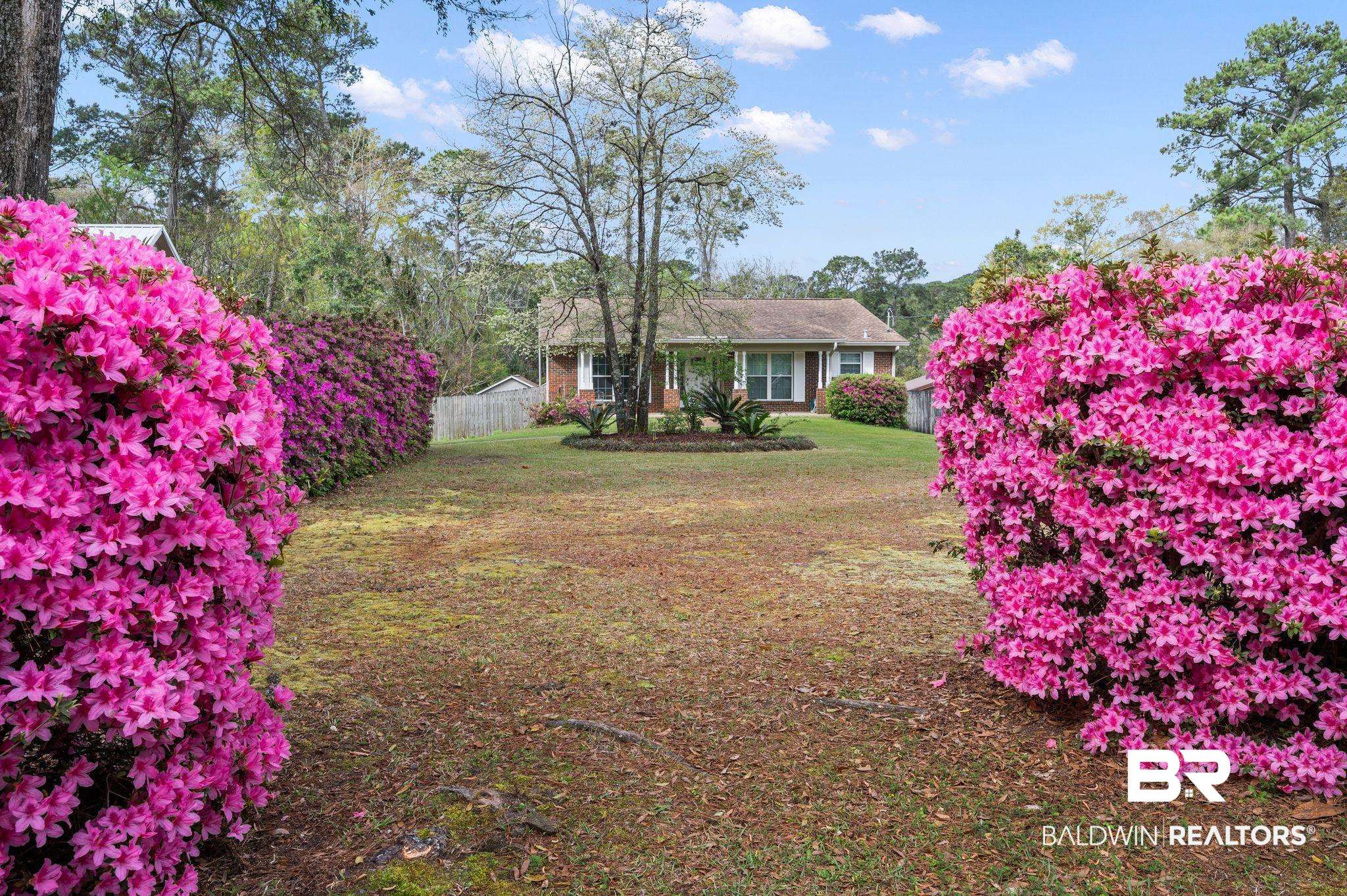 18 Lee Circle Spanish Fort, AL 36527 - Photo 44 of 50 Gorgeous azaleas abound, and home to a beautiful Dogwood tree.