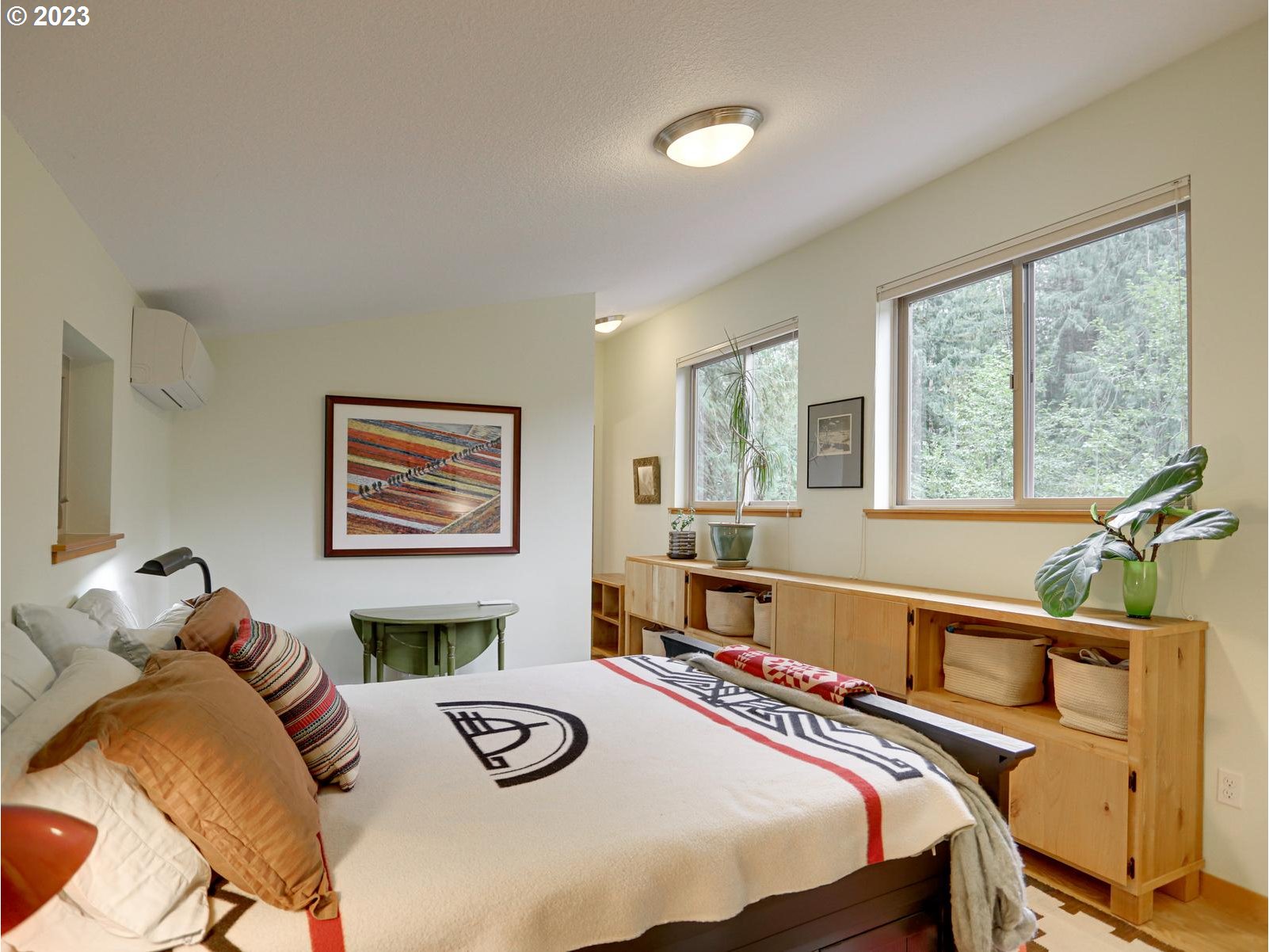 27279 East Henry Creek Road Rhododendron, OR 97049 - Photo 26 of 45 a bedroom with a bed and a large window