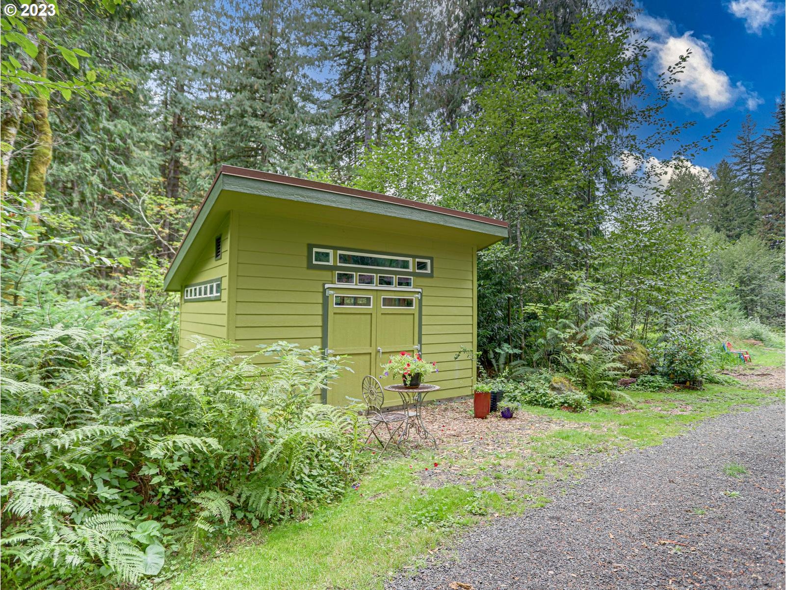 27279 East Henry Creek Road Rhododendron, OR 97049 - Photo 36 of 45 a small garden covered with tall trees