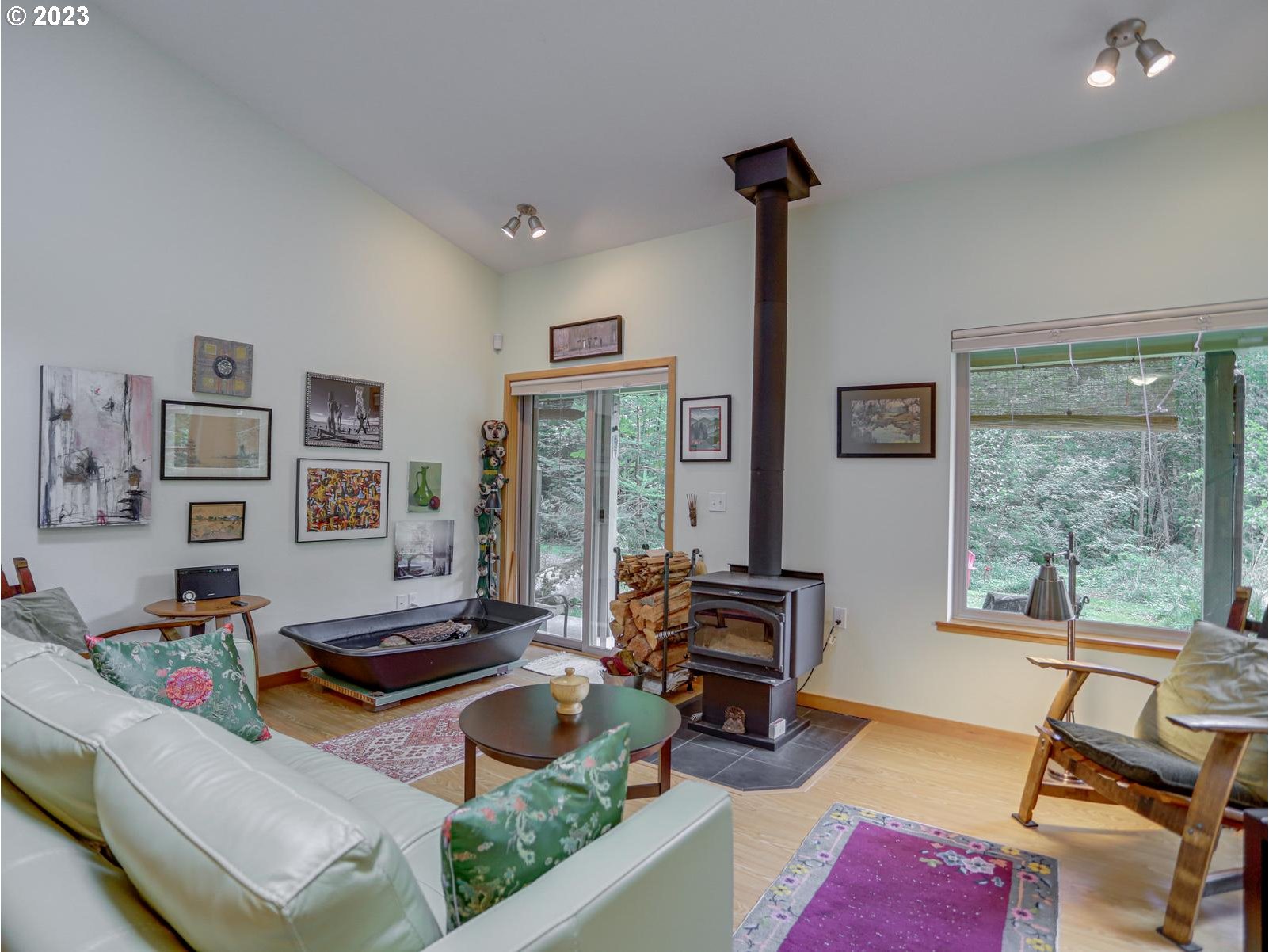 27279 East Henry Creek Road Rhododendron, OR 97049 - Photo 10 of 45 a living room with furniture and a large window