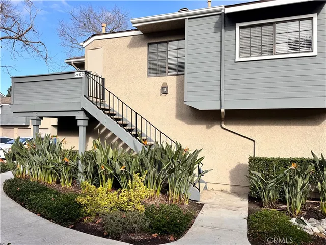 a view of a house with a flower garden