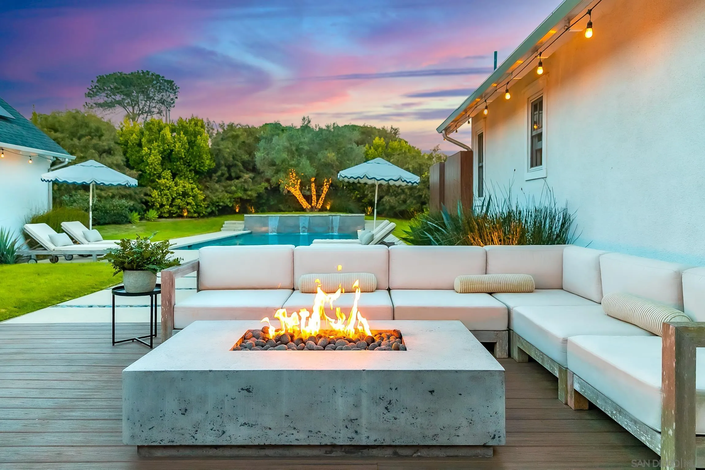 1245 Canton Court Encinitas, CA 92007 - Photo 23 of 71 a view of a patio with couches and a table and chairs with potted plants