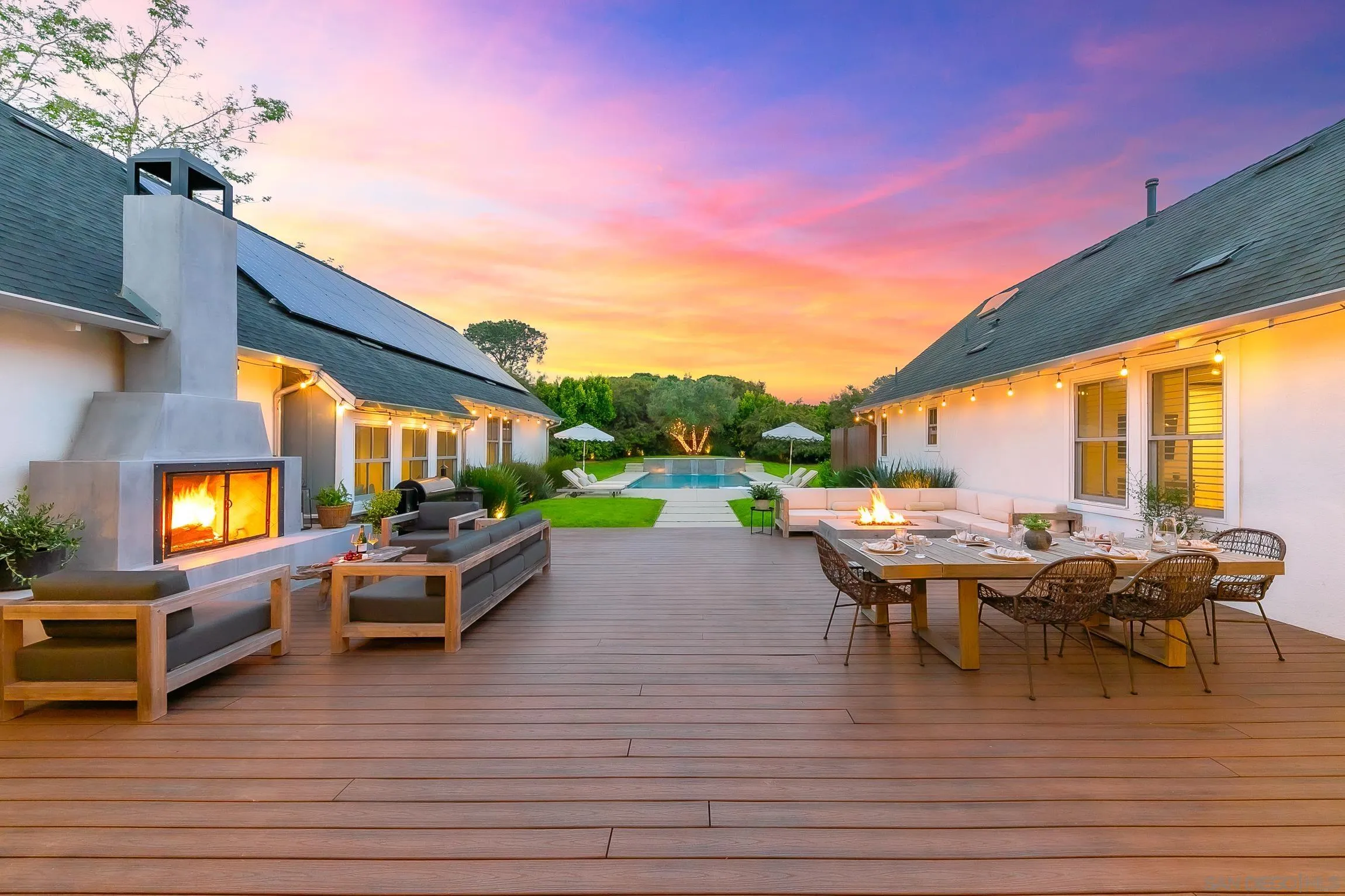 1245 Canton Court Encinitas, CA 92007 - Photo 28 of 71 a view of a patio with dining table and chairs with wooden floor